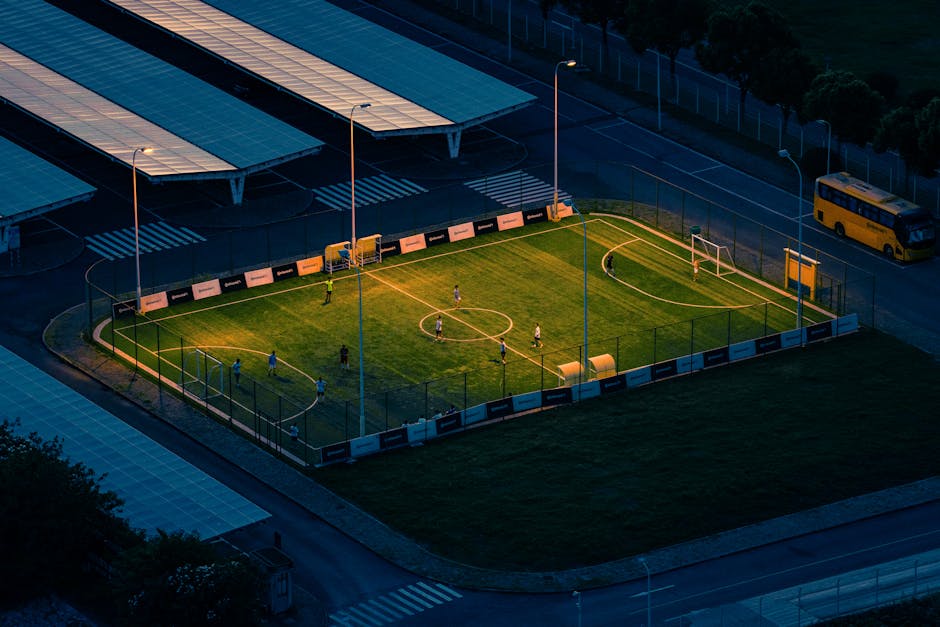 Floodlit football pitch at night — a typical UK Sportsbook market for Betway matched betting